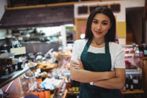female-staff-standing-with-arms-crossed-super-market_107420-63706