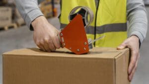 man-warehouse-working-with-packages_23-2148886842