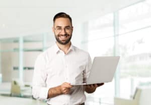 business-sucessful-businessman-working-with-laptop-using-computer-smiling-standing