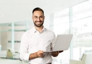 business-sucessful-businessman-working-with-laptop-using-computer-smiling-standing
